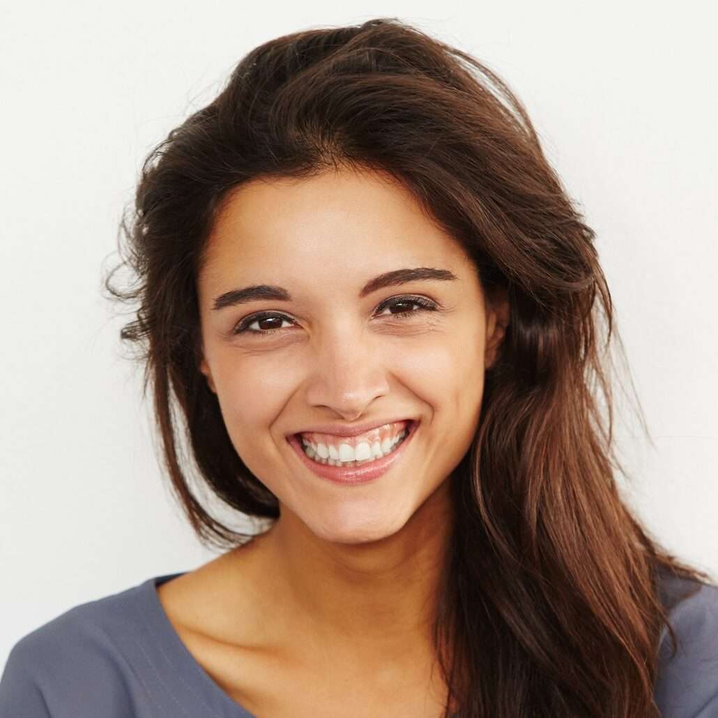 beautiful female smiling against white background